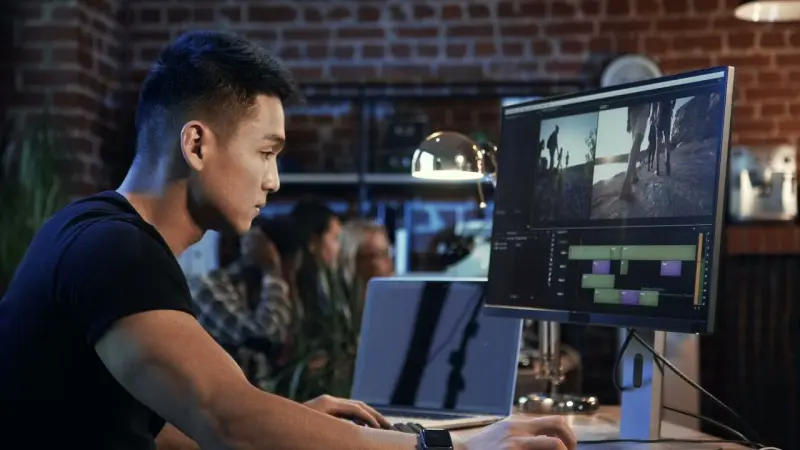 young man doing video editing